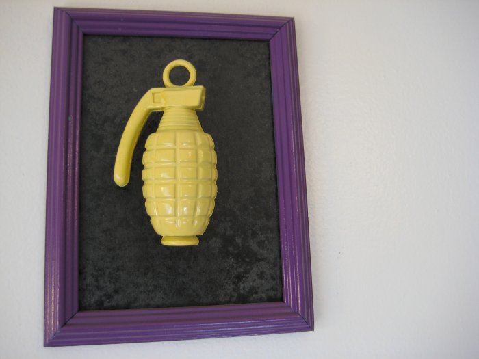 yellow grenade on black and purple