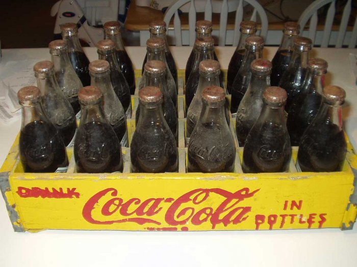 24 Unopened 75th Ann. Coca Cola Bottles In Yellow Crate