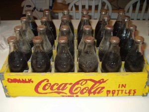 24 Unopened 75th Ann. Coca Cola Bottles In Yellow Crate