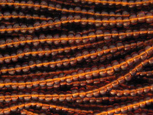 11/0 CZECH GLASS SEED BEADS TRANSPARENT DARK TOPAZ 1 HANK