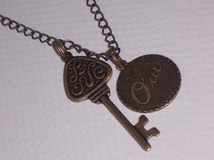OUI Love Key Pendant on antiqued brass chain necklace