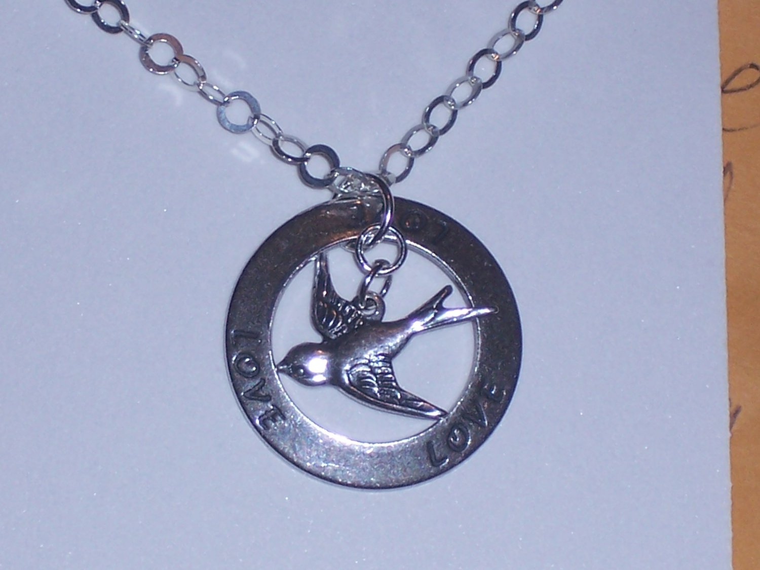 Sparrow Bird Necklace over a Love Circle Ring on Sterling silver Chain FREE SHIPPING TO THE U.S.