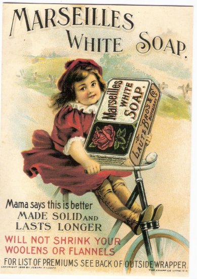Reprint of vintage Marseilles white soap ad little girl on bike