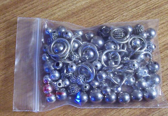 Grab bag of silver metal beads spacers rings for crafting