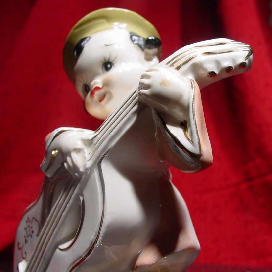 Good Lookin Vintage Lil Guy With a Huge Guitar Vase