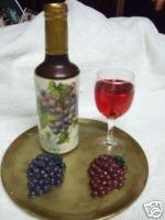 Wax wine bottle and grapes