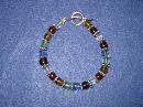 Multi Colored Handmade Beaded Bracelet with Blue, Green, Amber, Purple, Red and Silver Beads