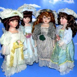 16" ELEGANT BRUNETTE PORCELAIN DOLL.