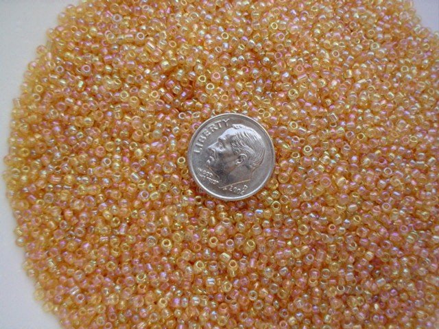 Size 11 Celestial rainbow beads tan 15 grams