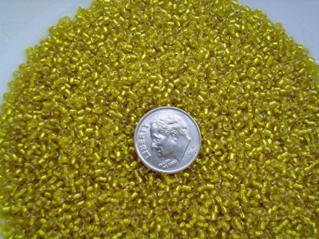 Size 11 Celestial silver lined beads yellow 15 grams