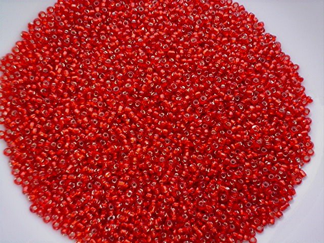Size 11 Celestial silver lined beads red 15 grams