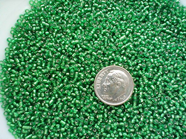 Size 11 Celestial silver lined beads emerald15 grams