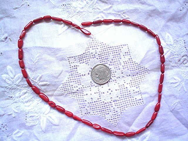 Red coral rice beads 15 inch strand