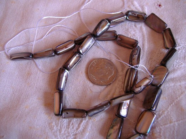 Polished Abalone oblong beads 14 to 15 mm 16 inch strand.