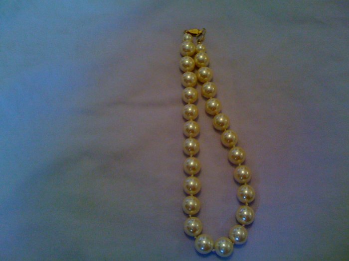 Faux pearl necklace.