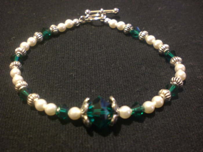 Swarovski crystal pearls in cream and Swarovski crystals in emerald with silver components