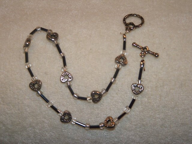Black beads with silver toned hearts anklet