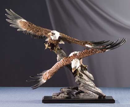 Two Eagles Soar Over Rocks
