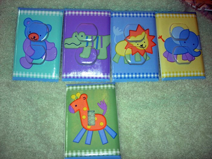 Light switch covers with Safey plugs m/w tiddliwinks safari