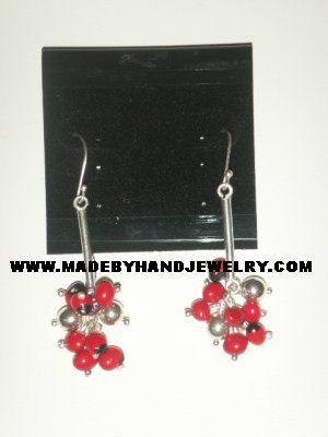 Handmade .950 pure silver earrings with Huayruro seeds