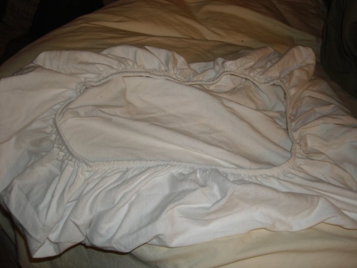 White fitted bassinet sheet