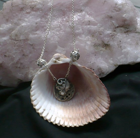 .999% Fine silver shell with CZ