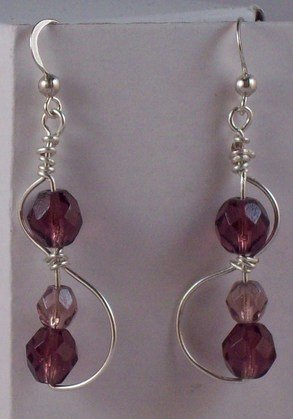S with purple beads