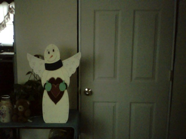 Angel Wood sign that lights