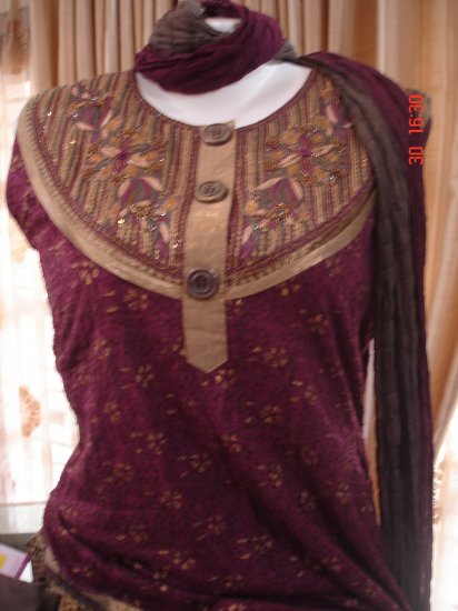 T-491: Pink textured Ready made Suit with golden paint and embroidery at neck