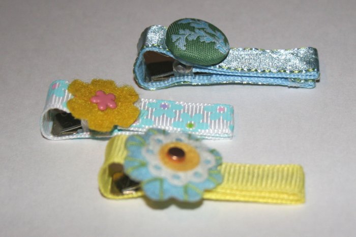 Set of three blue and yellow vintage alligator clips