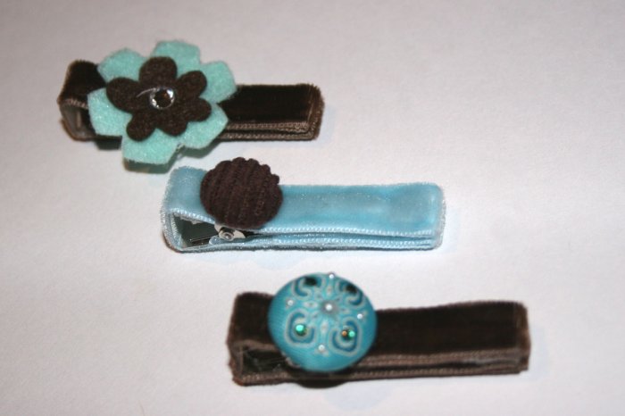 Set of three brown and blue velvet alligator clips