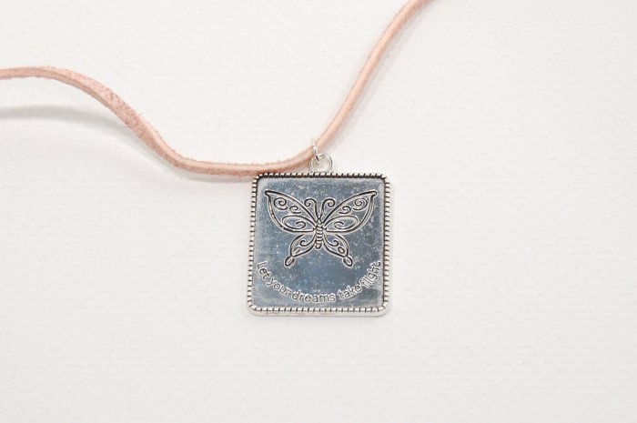 Butterfly Charm on Pink Suede