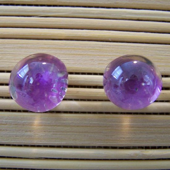 glass with purple stud earrings