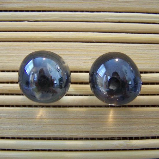 glass with black stud earrings