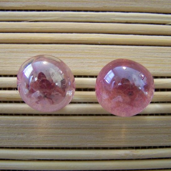 glass with pink stud earrings