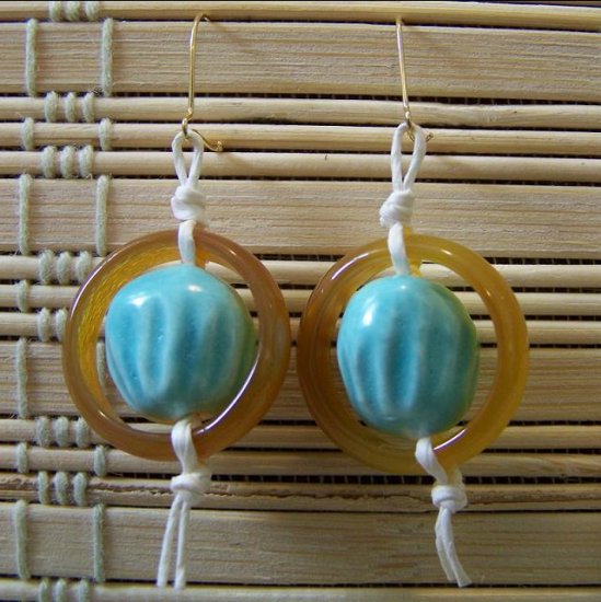 yellow stone ring with blue bead dangle earrings