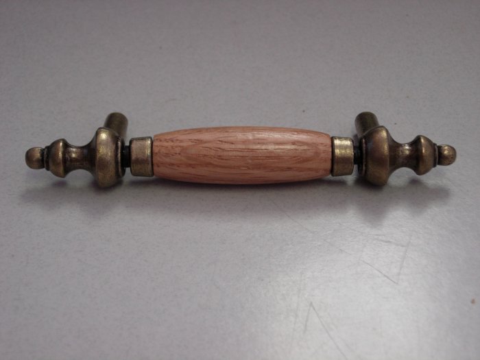 10 Amerock Oak and Brass Cabinet Handles or Pulls.