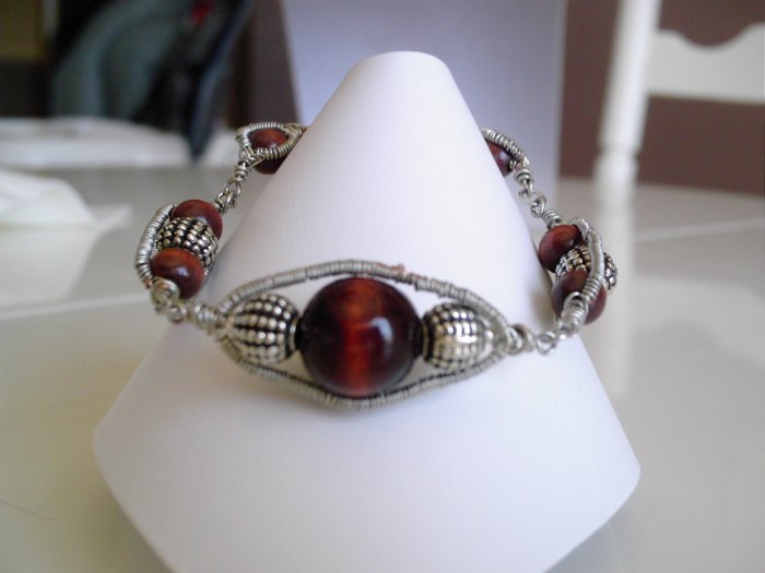 Dark wood and base metal wire bracelet