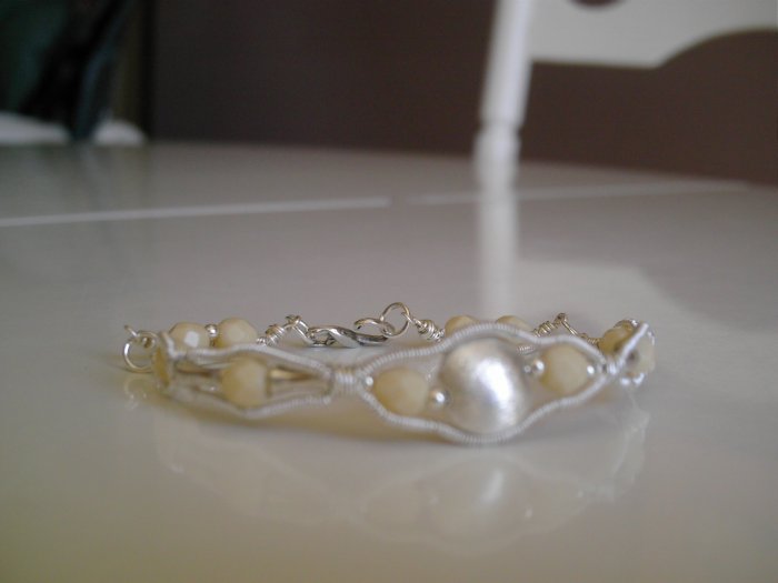 Antique ivory glass beads and plated silver wire bracelet