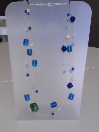 Illusion necklace made of blue glass beads.