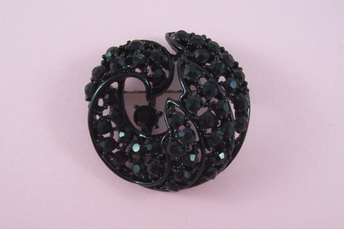 Vintage Black Rhinestone Brooch Domed Swirling Design