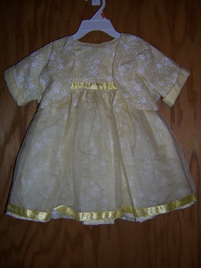 Yellow and white floweres party dress size 6-9 mos.