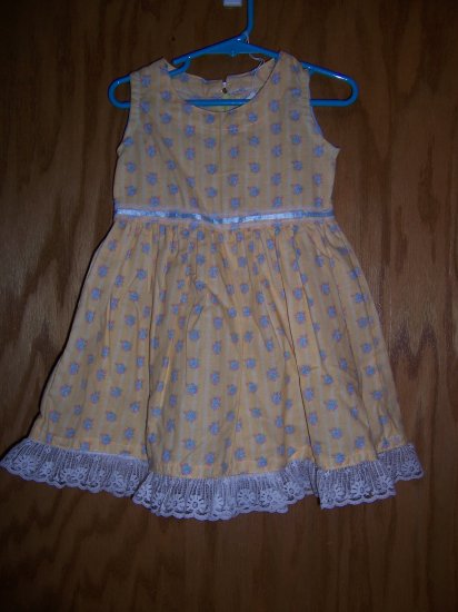 Yellow party dress with whit lace trim. Size 2