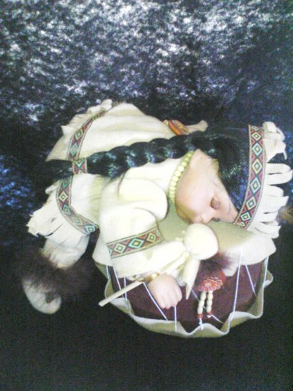 indian doll on a drum