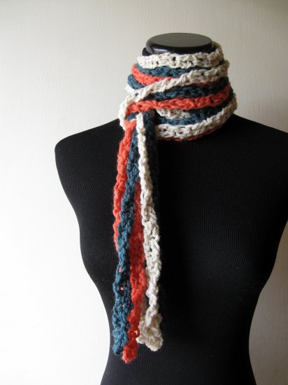 the twisted colors scarf in teal, cream, and mango.
