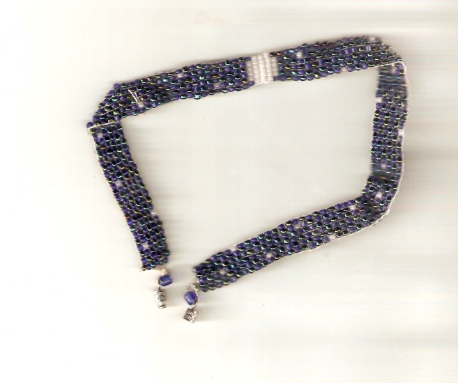 Dark blue beaded choker with white accents inspired by the night sky.