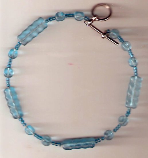 bracelet made of light blue glass beads on memory wire. Approximately 9 inches around