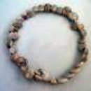 bracelet made of wire and escargot shells on memory wire.