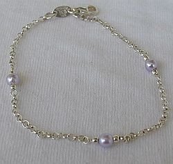 Silver bracelet with purple beads