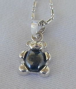 Teddy bear pendant.